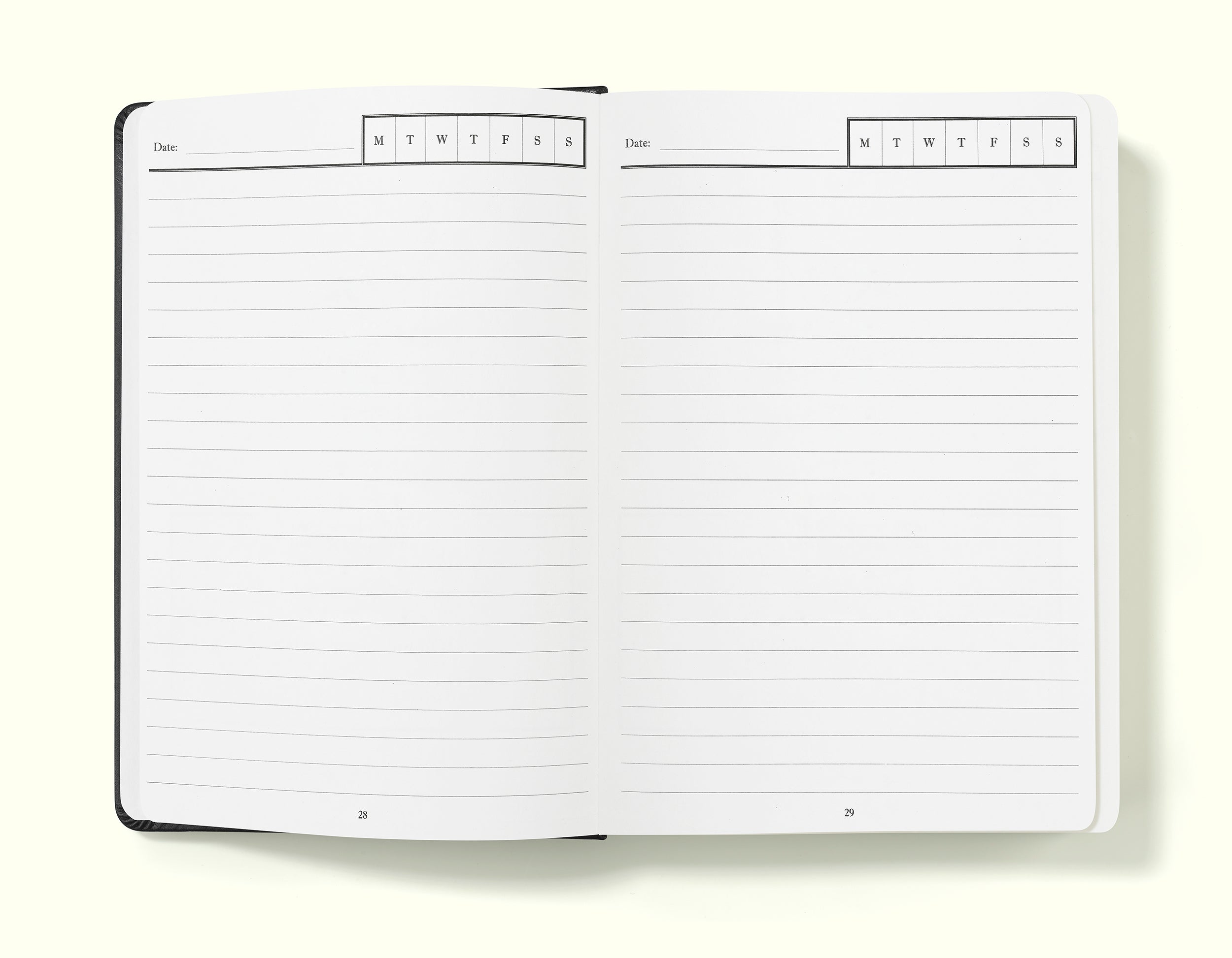 day per page diary pages of black undated daily journal in a5 sitting on blank background