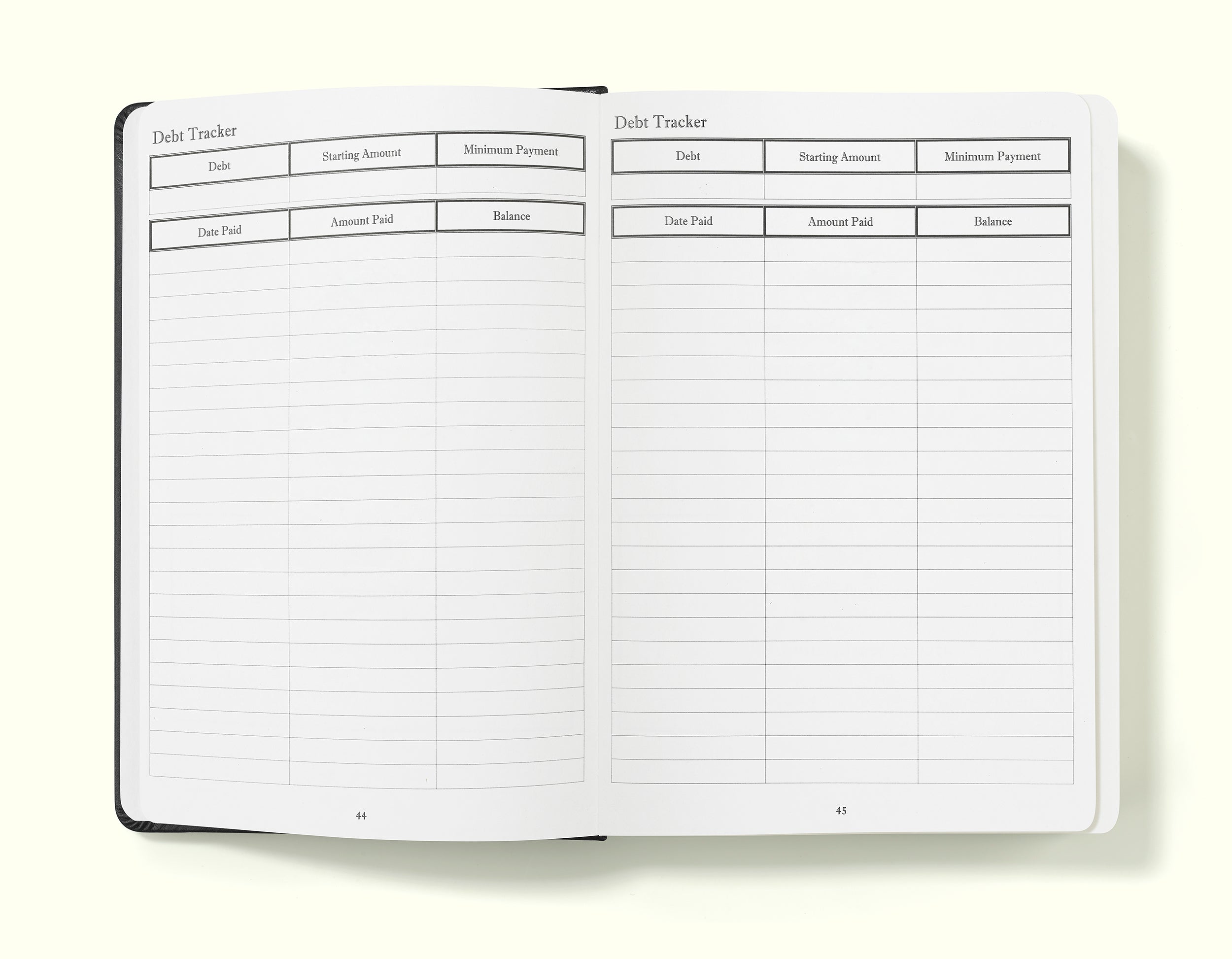 debt tracker of black financial planner and budgeting book in a5 on a blank background