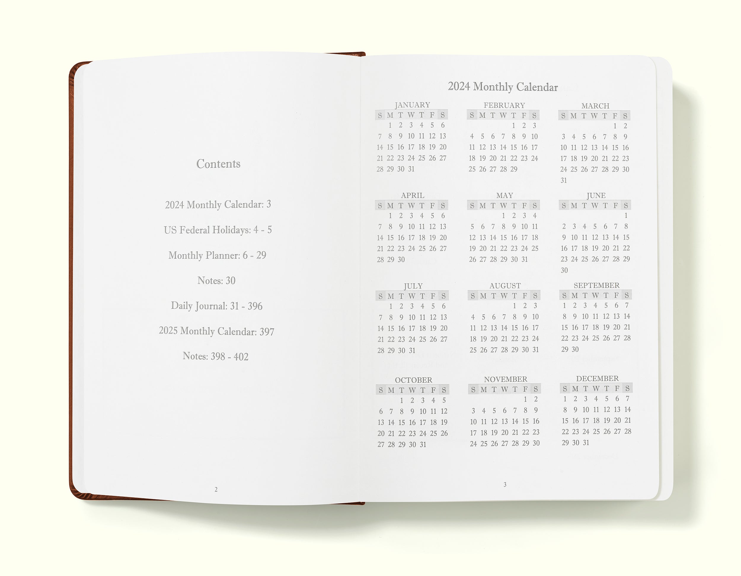 contents and 2024 calendar pages of brown 2024 daily journal in a5 sitting on blank background