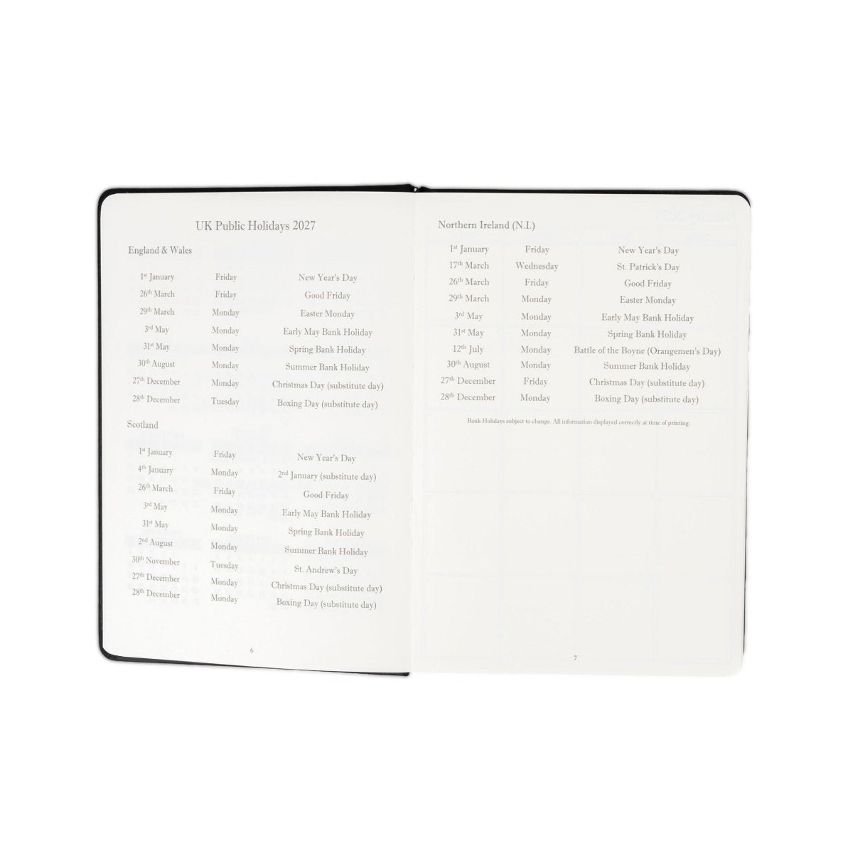 Planner interior open spread with holiday lists and note sections