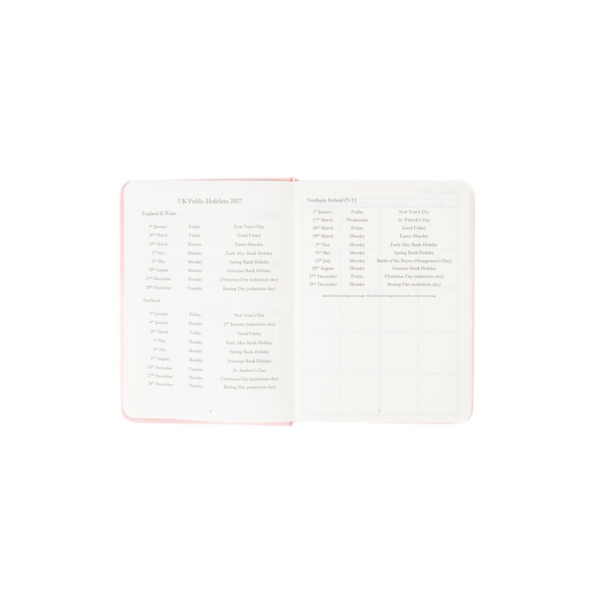 Planner interior open spread with holiday list pages and month grid