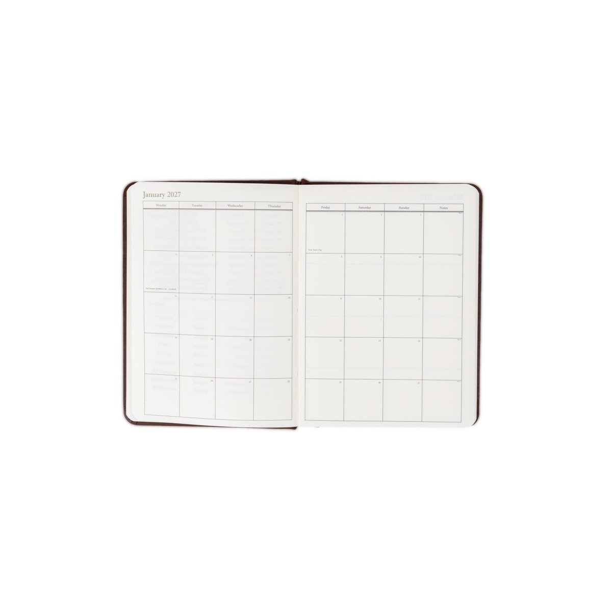 Planner interior open spread with date grids and clean writing sections