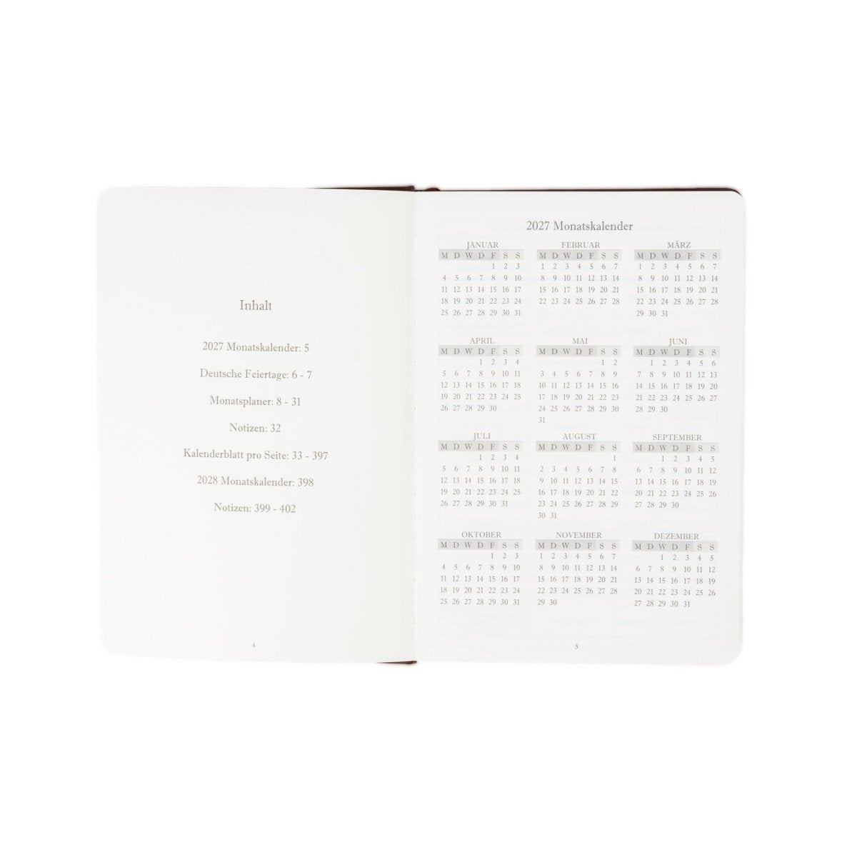 A5 executive journal open spread with contents list and monthly calendar, soft pink edge binding