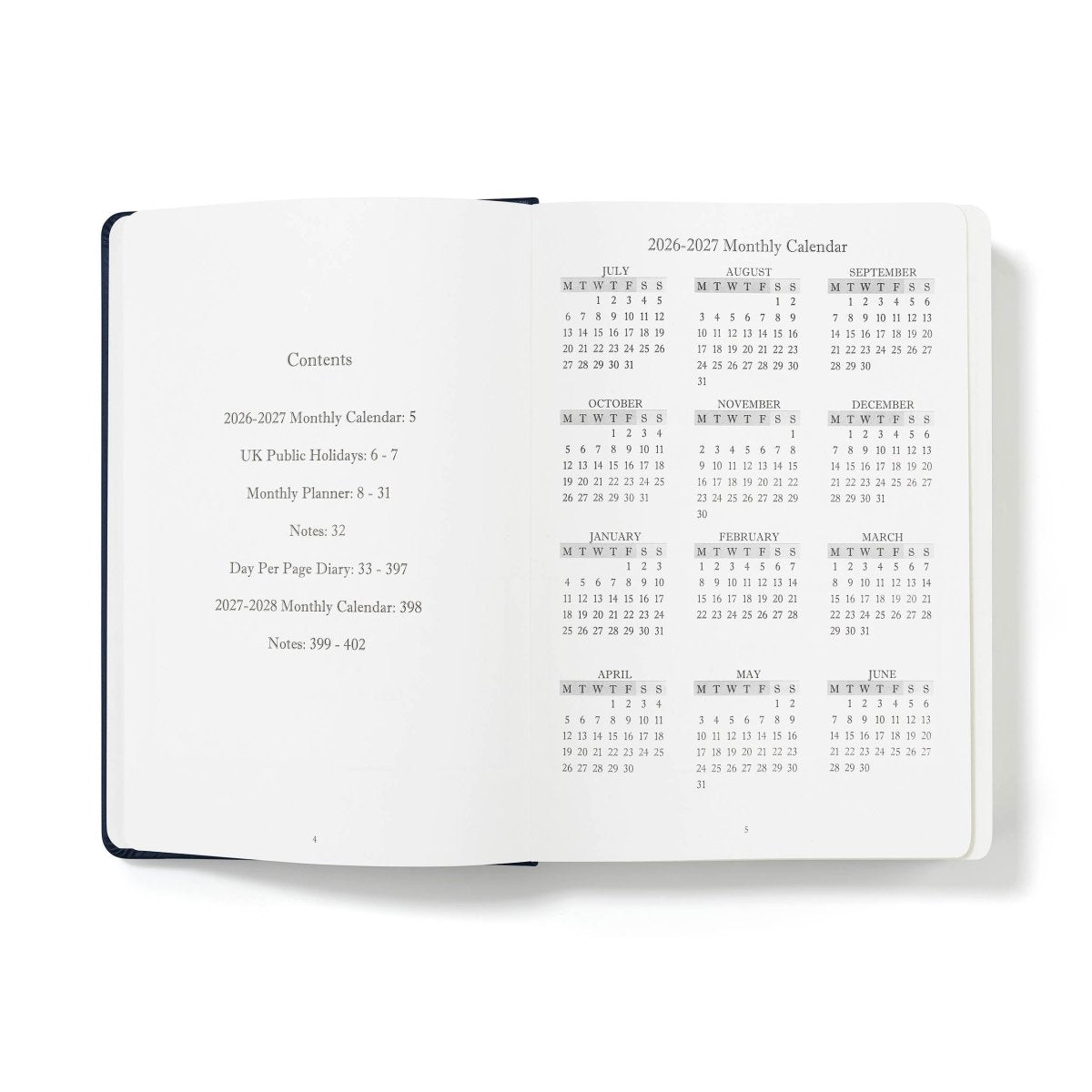 Mid-year executive journal open to contents and 2026–2027 monthly calendar