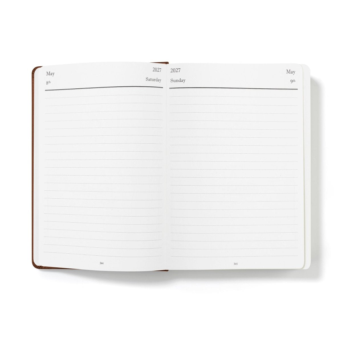 Open journal pages with ruled planning lines for May, 2027–2028 dates, white paper