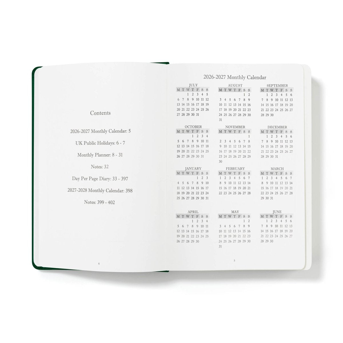 Executive journal open to monthly calendar and contents pages, with dark green edges