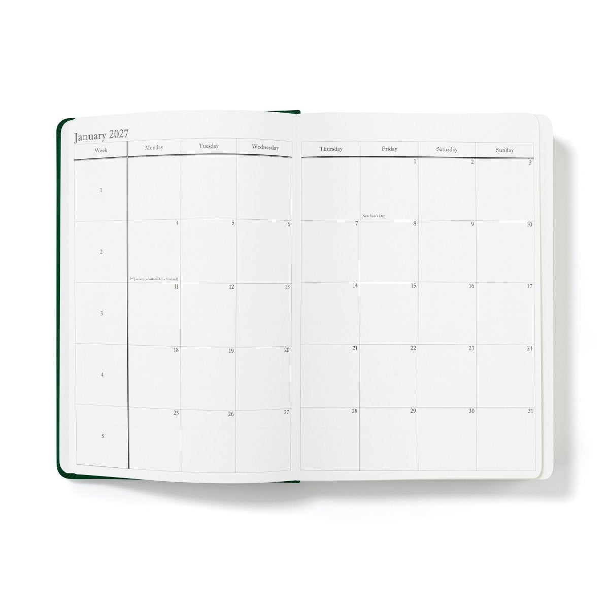 Executive journal open to calendar grid page with dark green outer binding edge