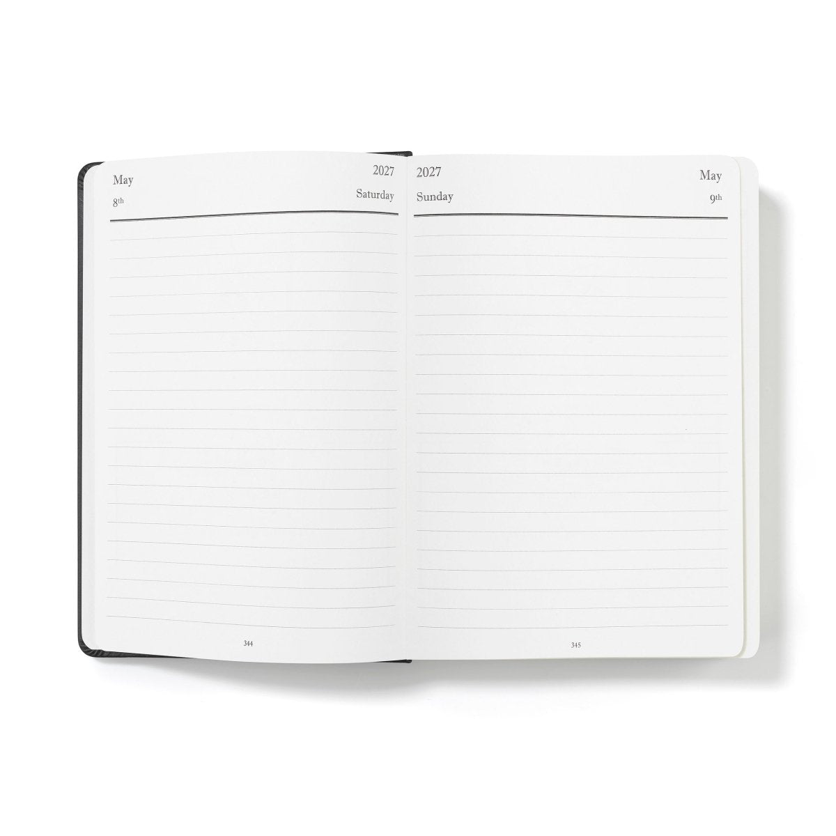 Mid-year executive journal open to lined weekly planning pages