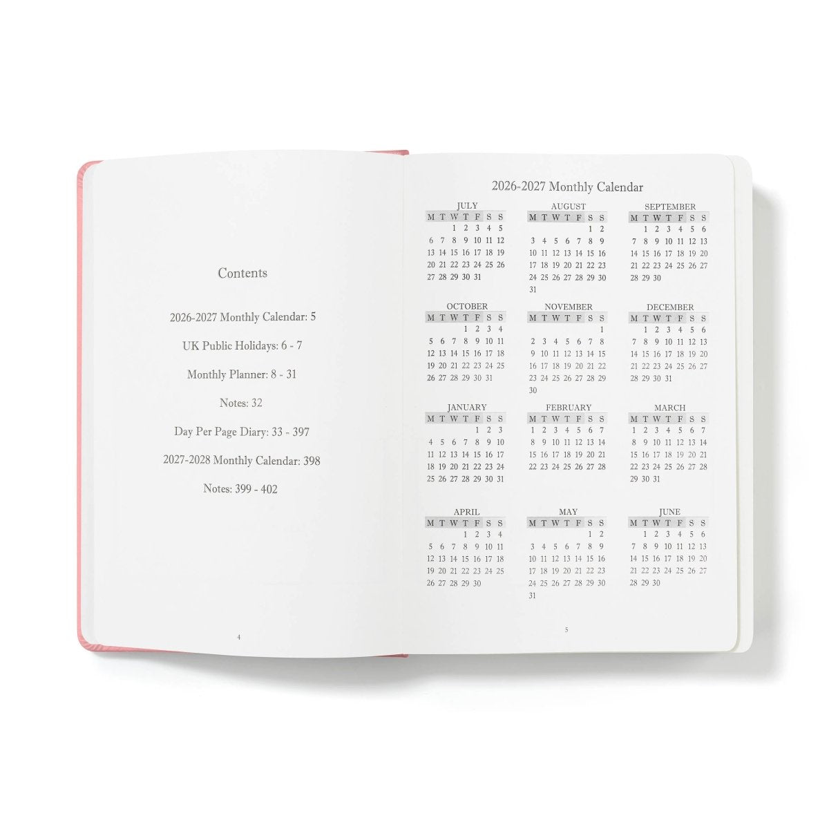 Executive journal open to monthly calendar and contents pages, with pink edges