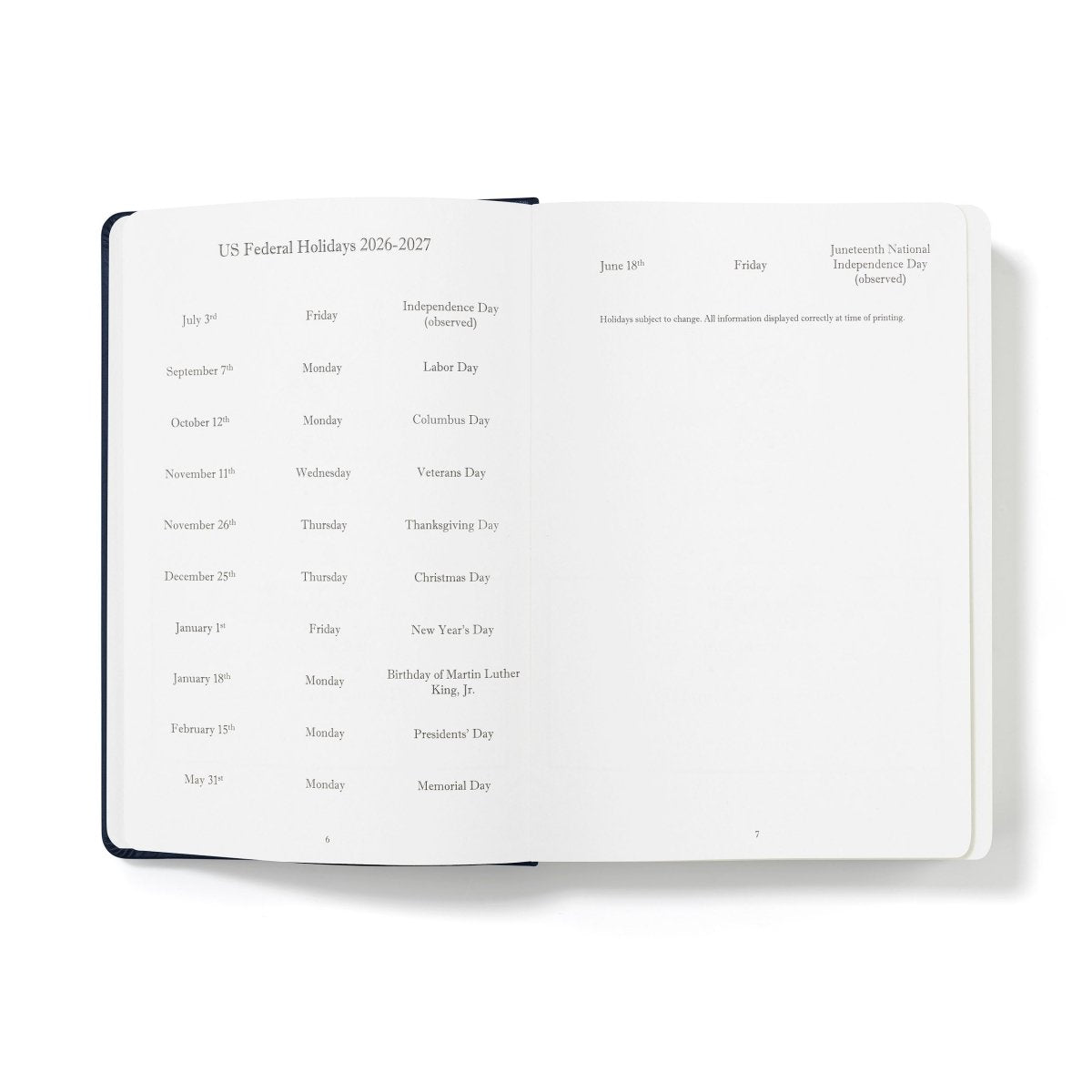 Executive journal open to US federal holidays list with date notes on white pages