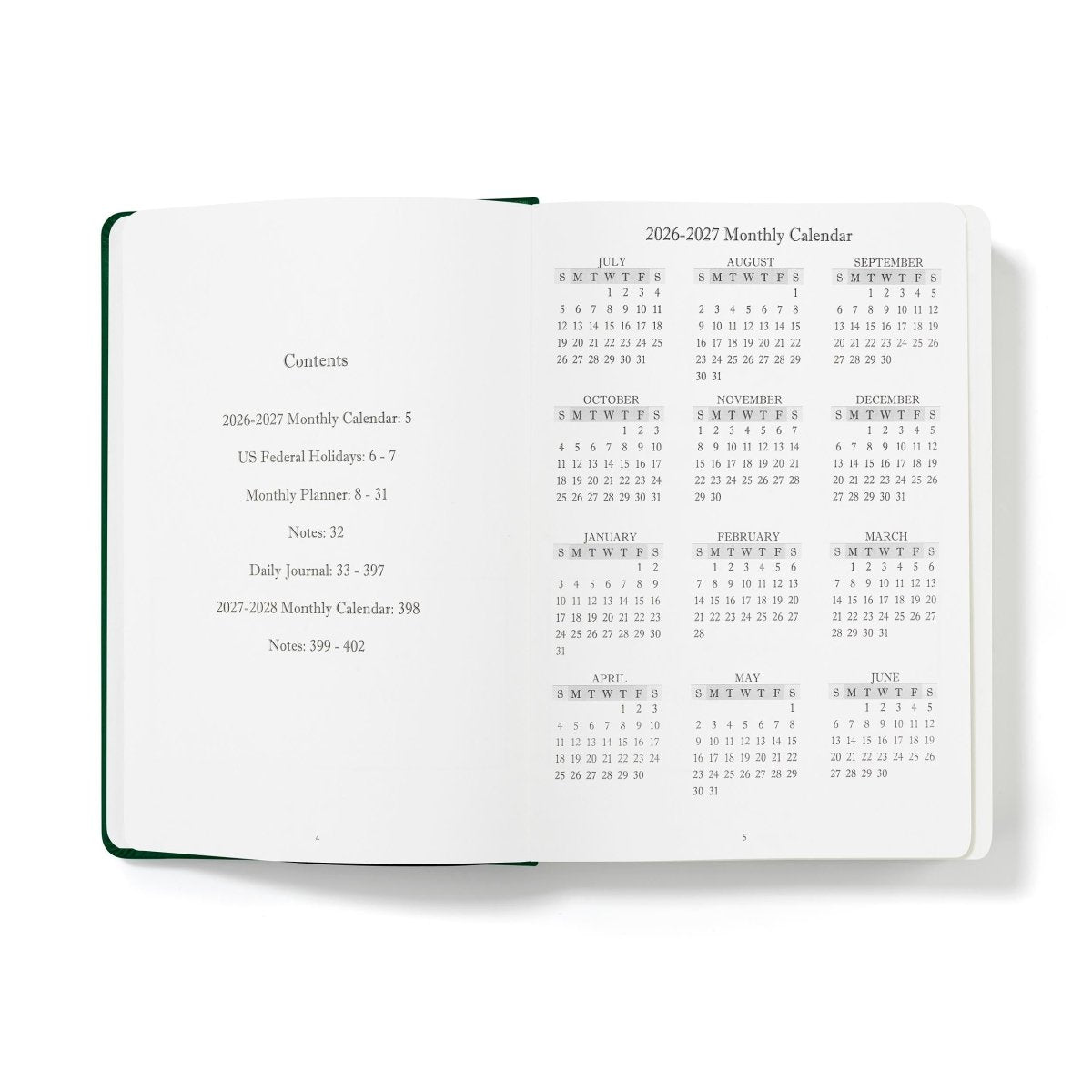 Green-edged open planner showing monthly calendar contents pages