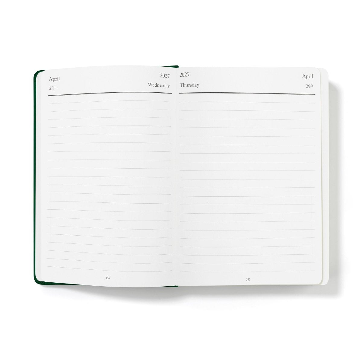 Green-edged open planner pages with lined monthly layout