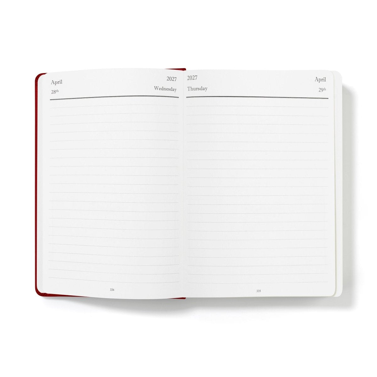 Open monthly calendar journal spread with blank lines and red binding edge