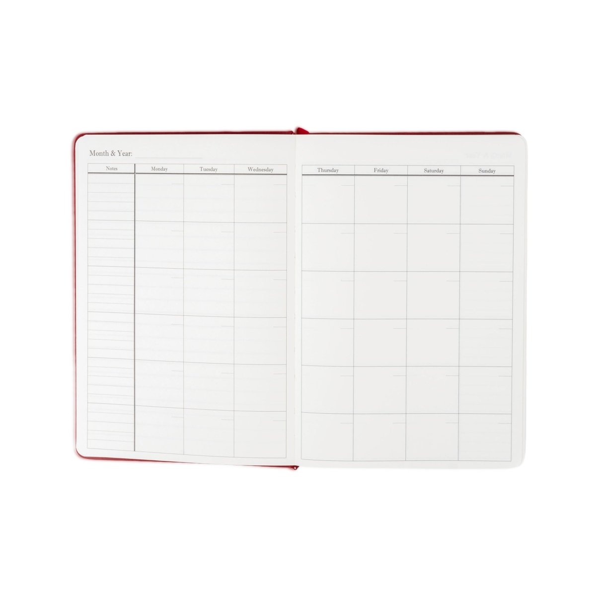 Undated planner journal opened to monthly and weekly grid pages, red trim.