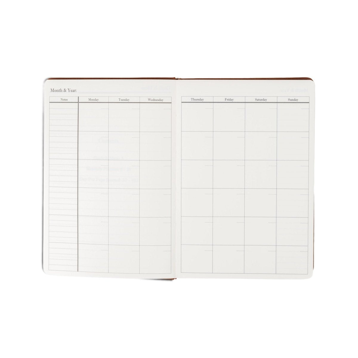 Undated planner journal opened to monthly and weekly grid pages.