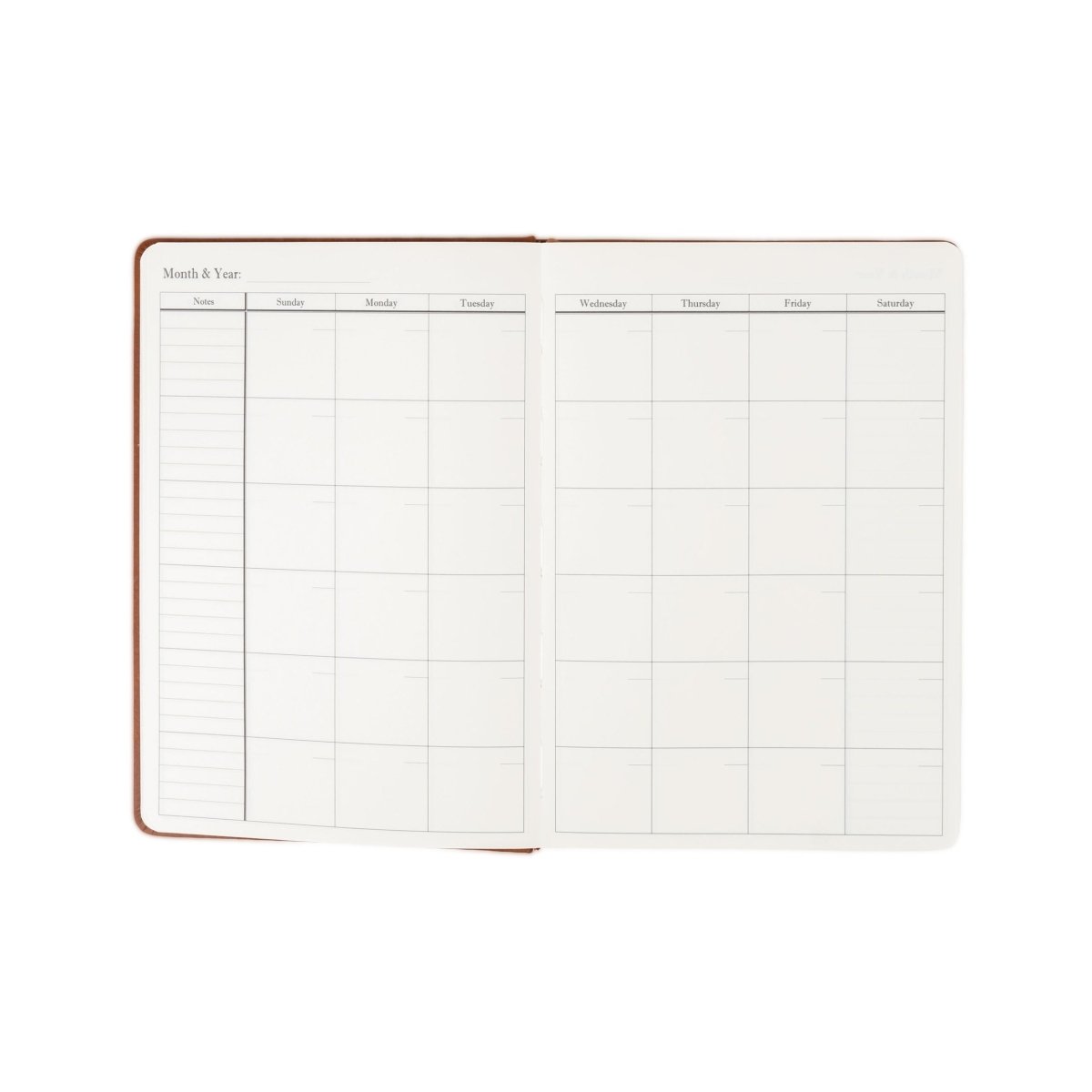 Undated weekly planner journal opened flat, showing weekly and weekend schedule grids.