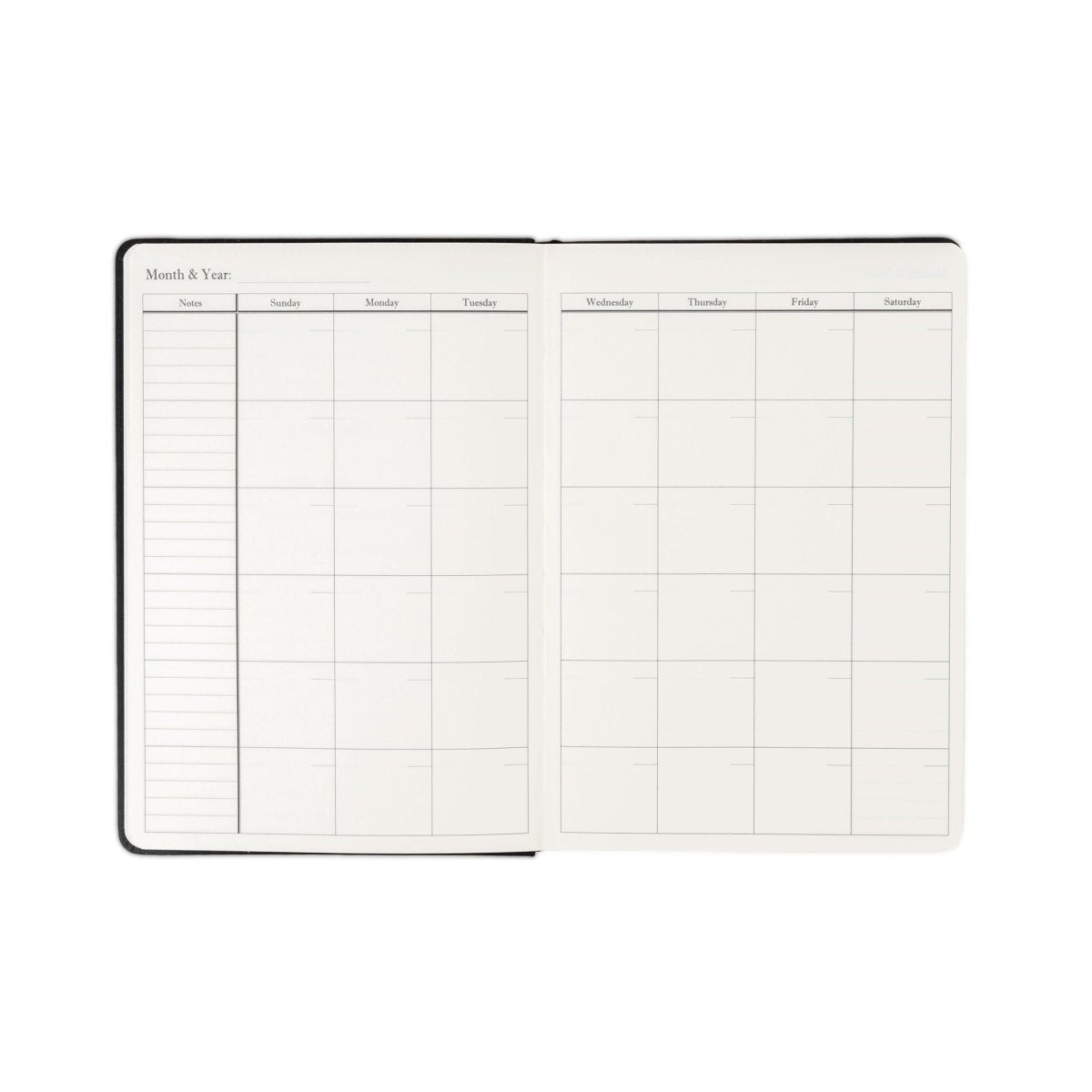 Undated weekly planner journal opened flat with weekly calendar grid and date rows.