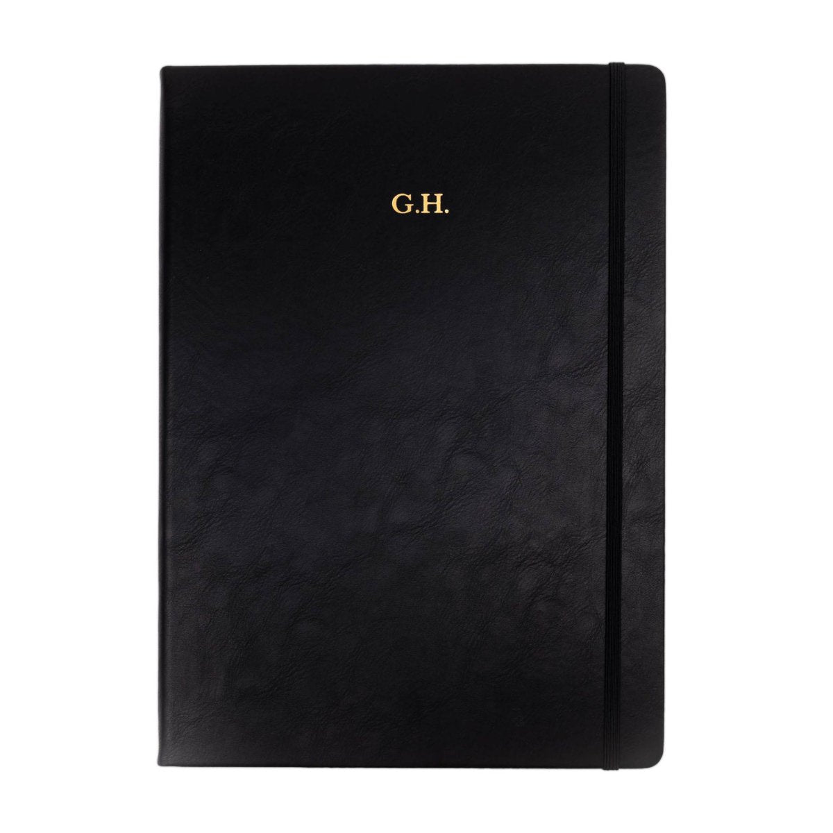 Black executive notebook with G.H. monogram centered on the front cover.