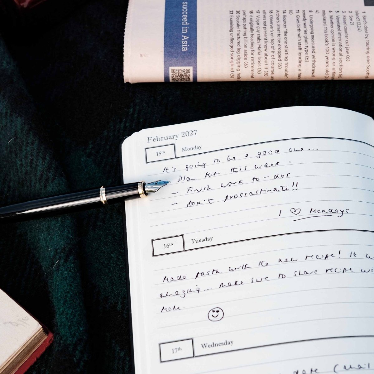 Weekly journal page detail with dated daily entries and ruled writing lines