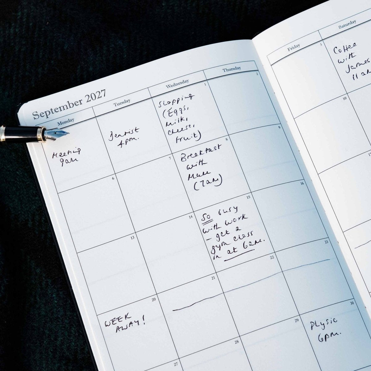 Weekly journal open to a September 2027 monthly calendar spread