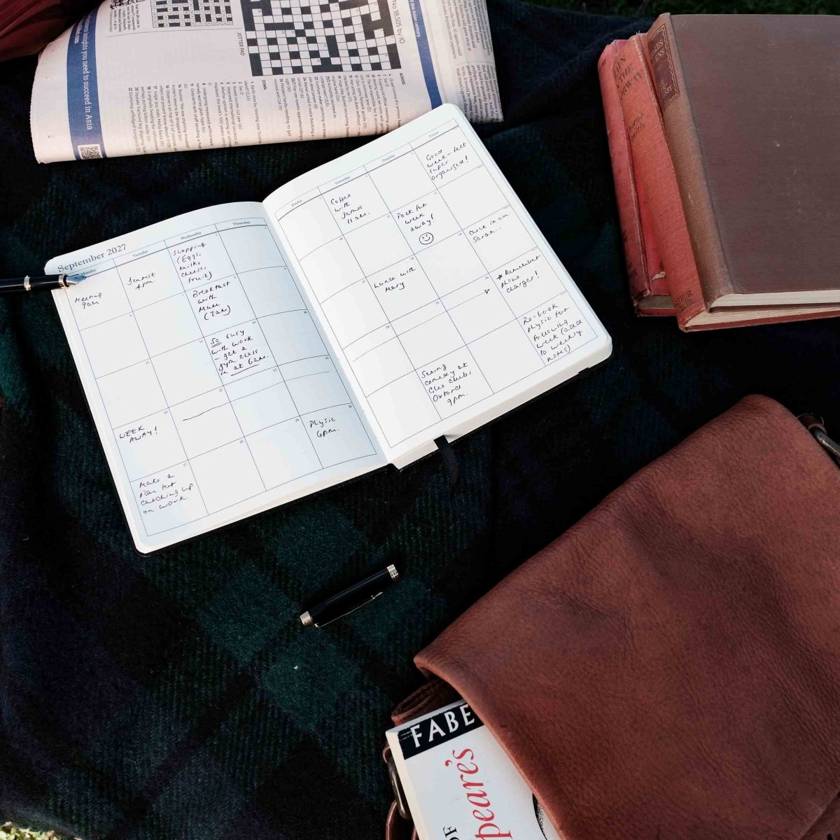 Weekly journal open to a handwritten weekly calendar spread