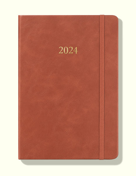 brown 2024 daily journal front in a5 sitting on blank background