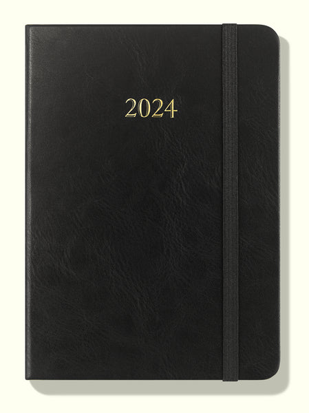front of black 2024 daily journal in a6 sitting on blank background