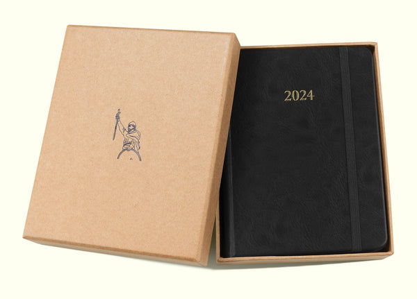 black 2024 daily journal in a6 with gift box sitting on blank background