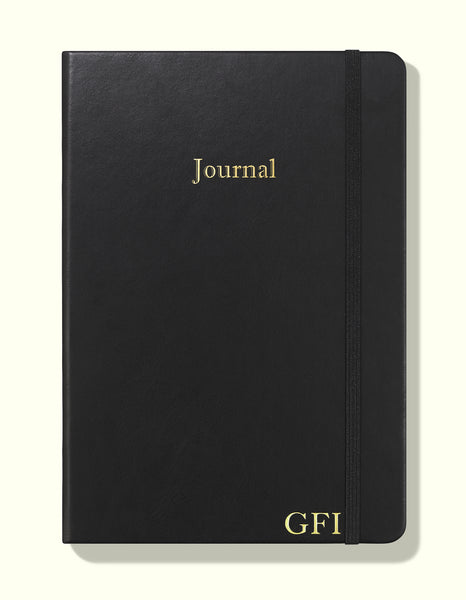 front cover of black undated daily journal in a5 with personalisation sitting on blank background