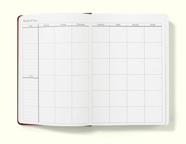 monthly planner section of brown financial planner and budgeting book in a5 on a blank background