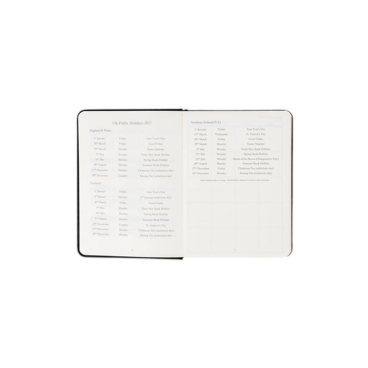 Planner interior open spread with holiday listings and monthly planning grid