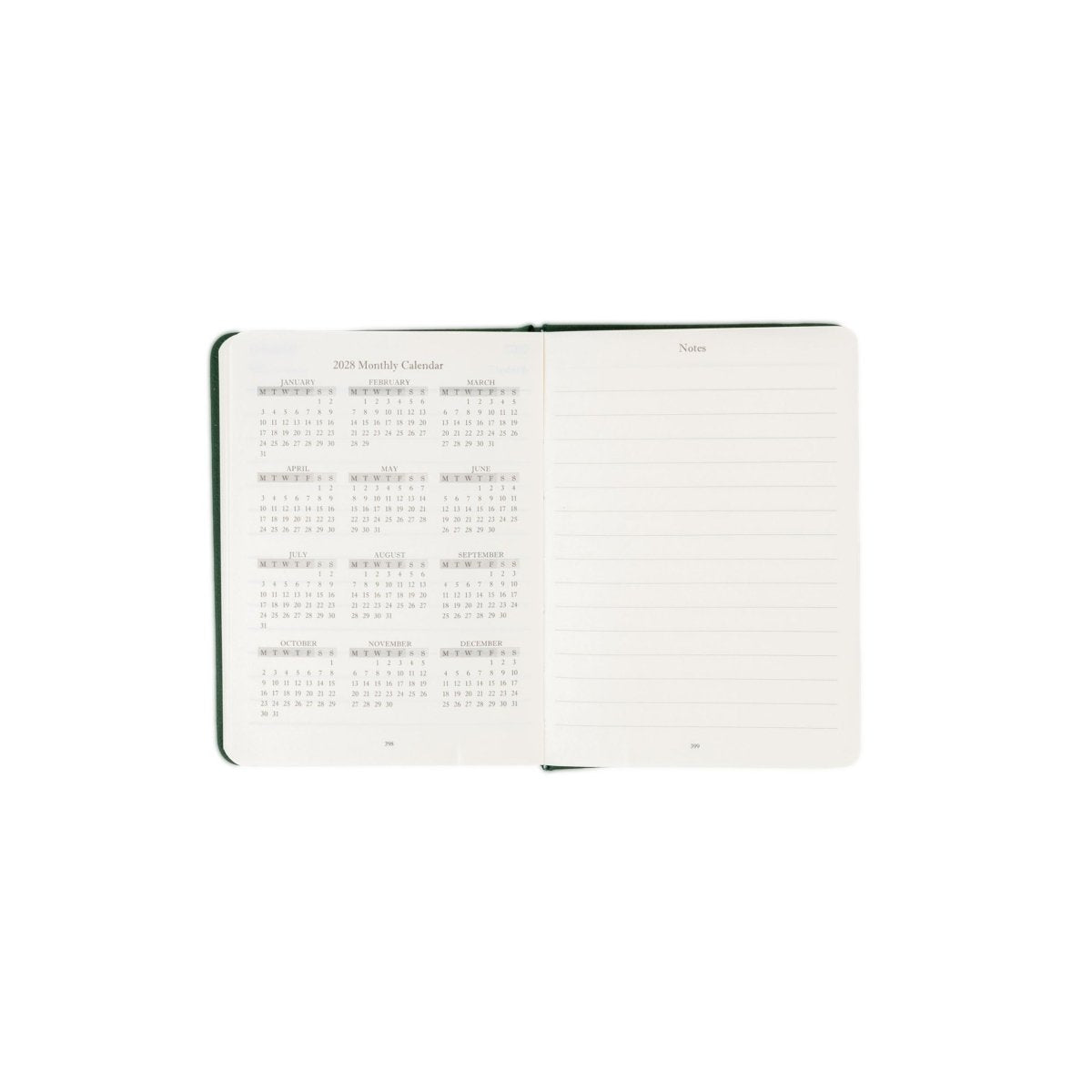 Planner interior open spread with monthly calendar grid and date labels