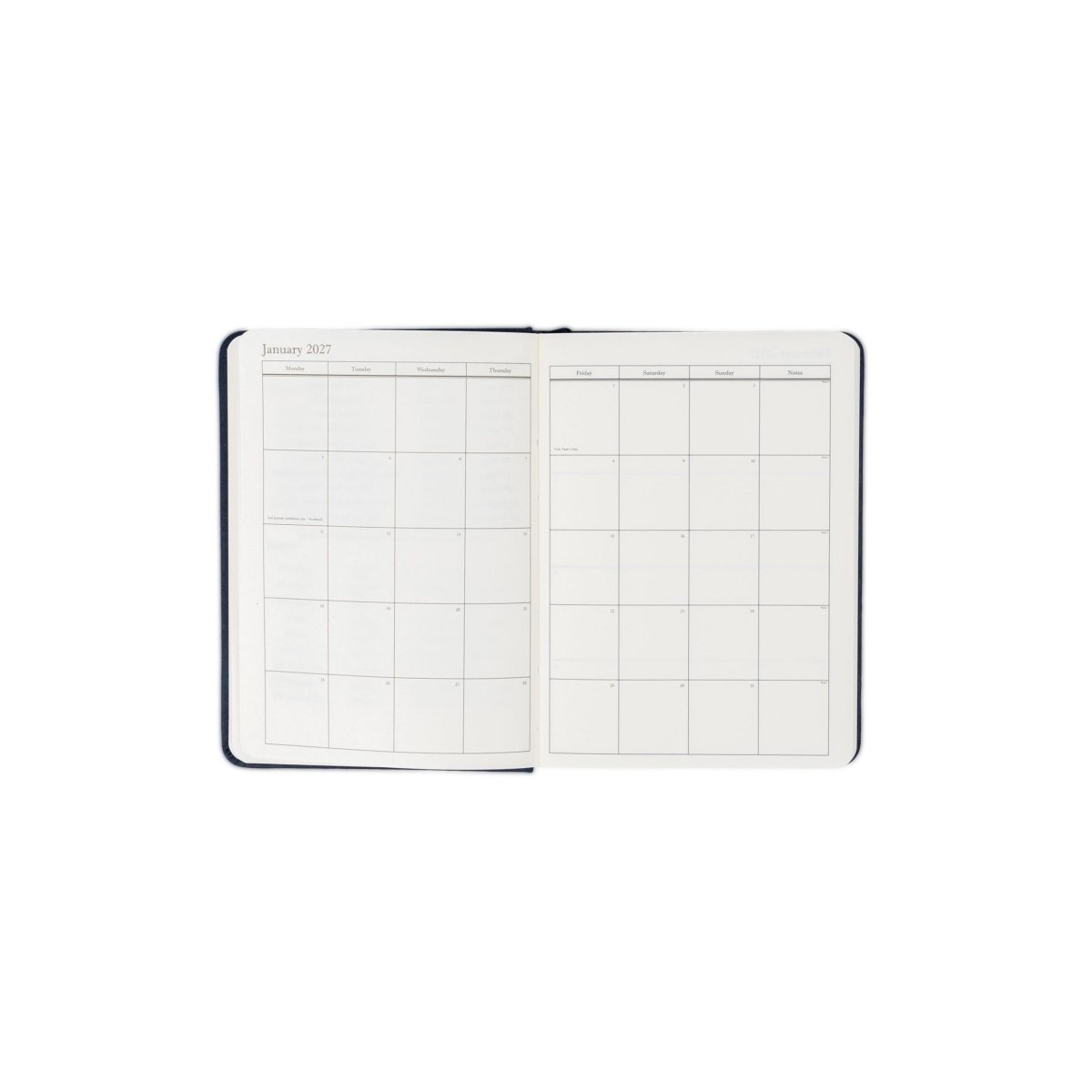 Planner interior open spread with monthly calendar layout and date headers