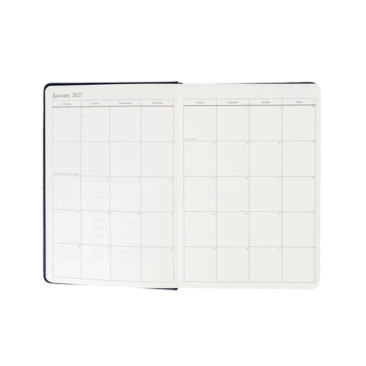 Planner interior open spread with monthly calendar grid and writing lines