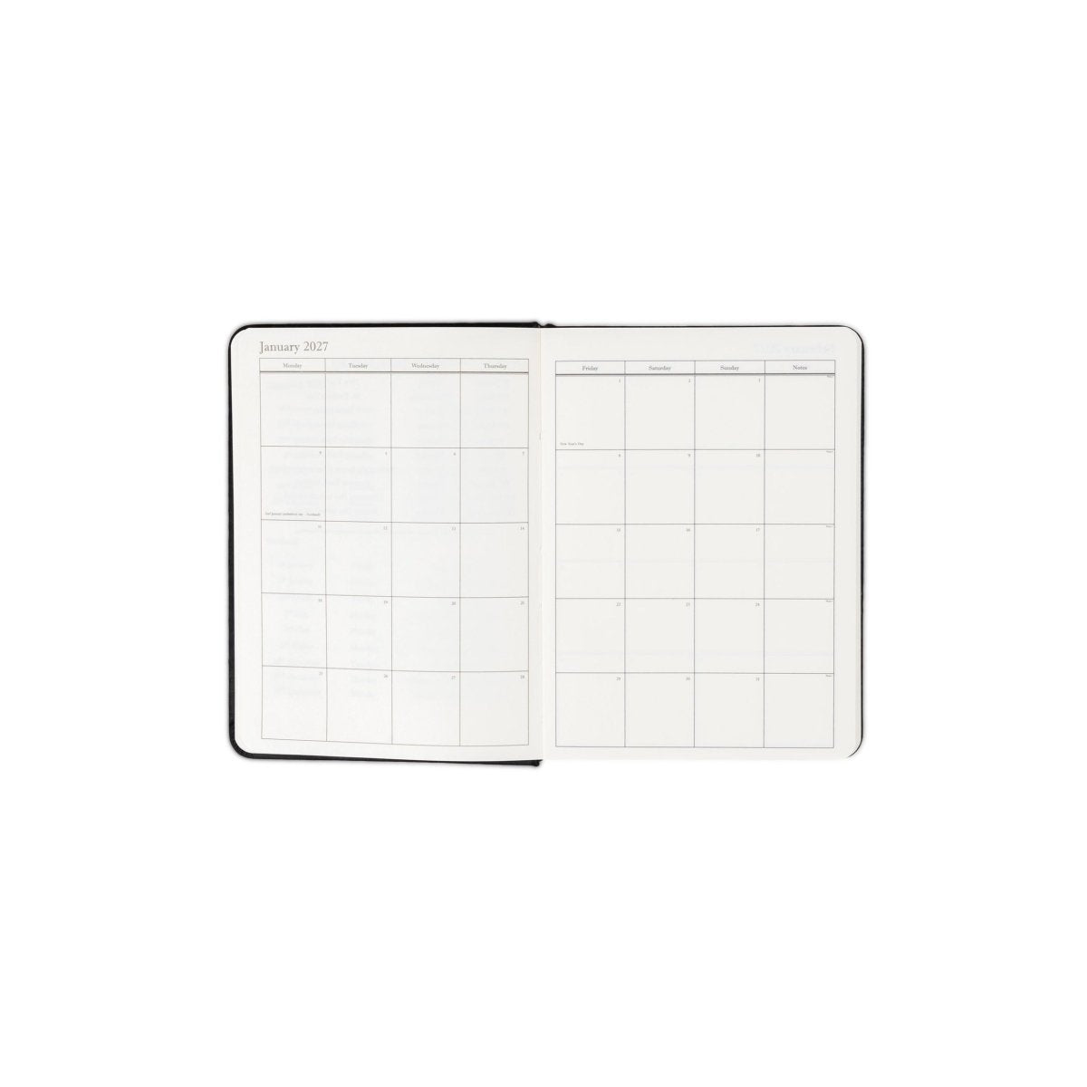Planner interior open spread with monthly calendar grid and date headings