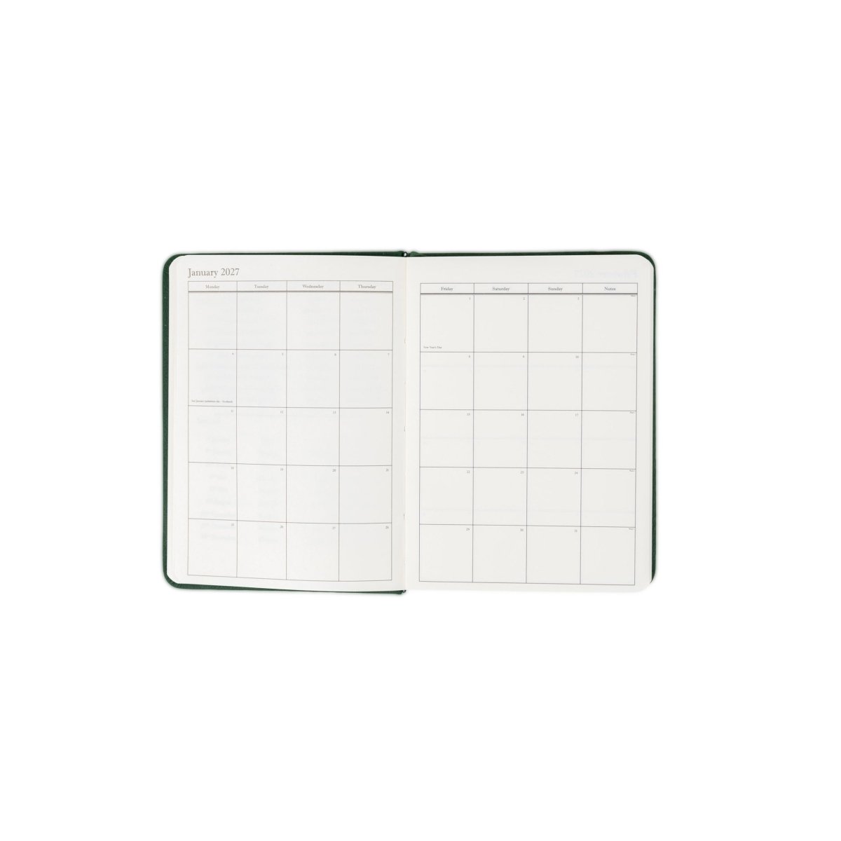 Planner interior open spread with monthly calendar grid and date labels