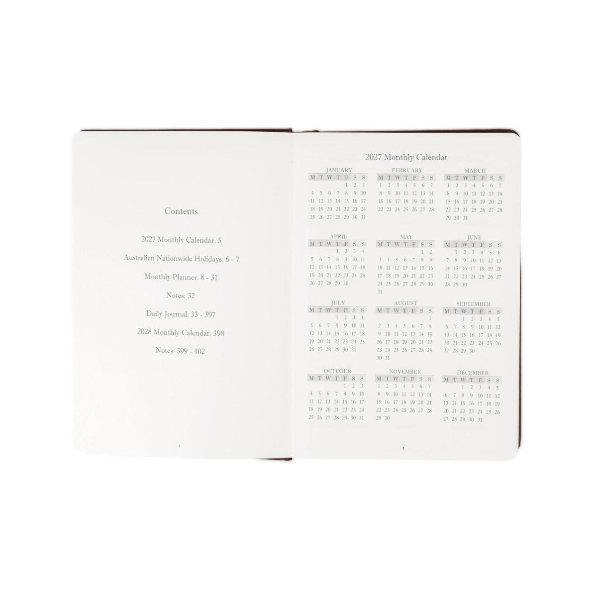 Open executive journal showing contents and “2027 Monthly Calendar” grid