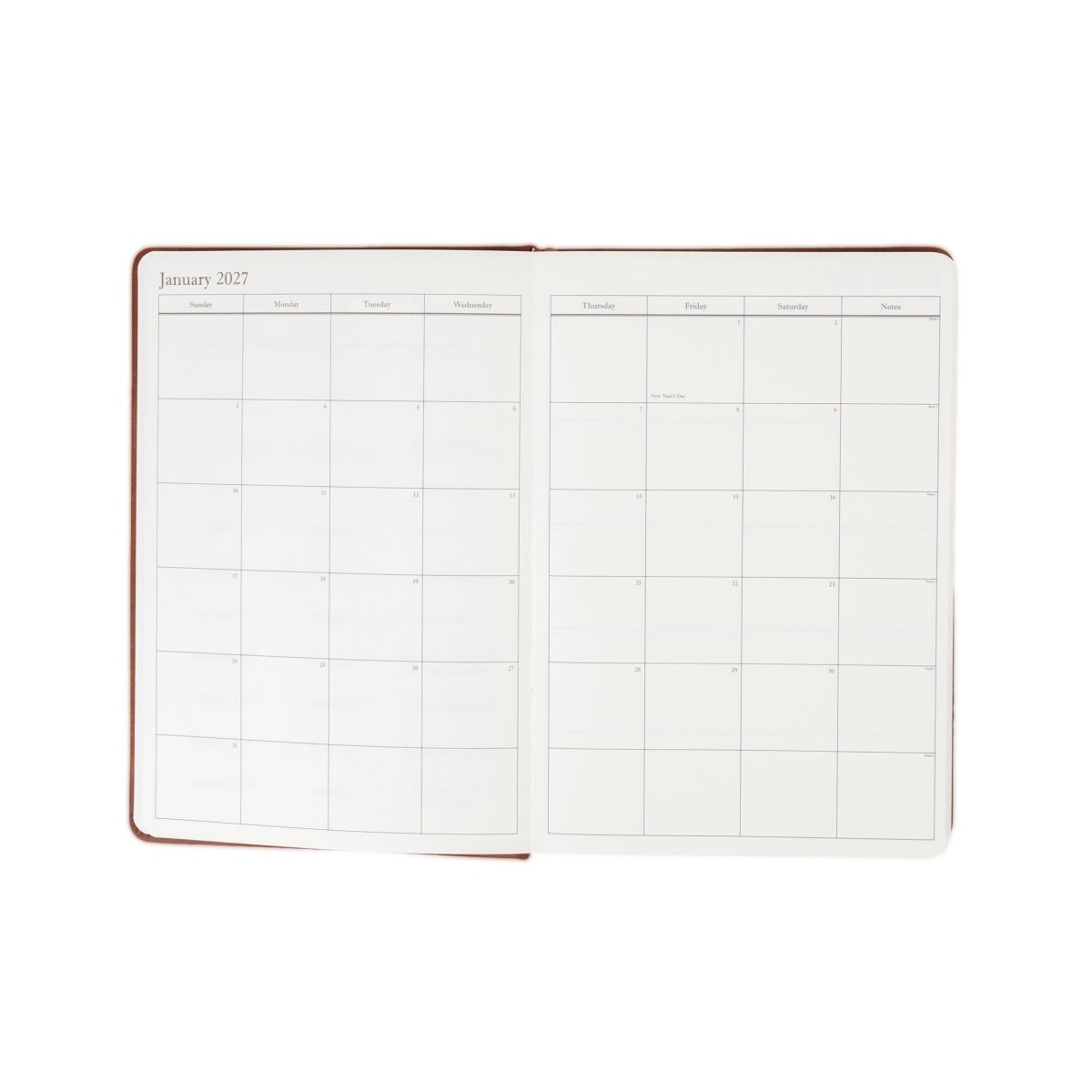 2027 executive journal opened with brown border and monthly calendar grid