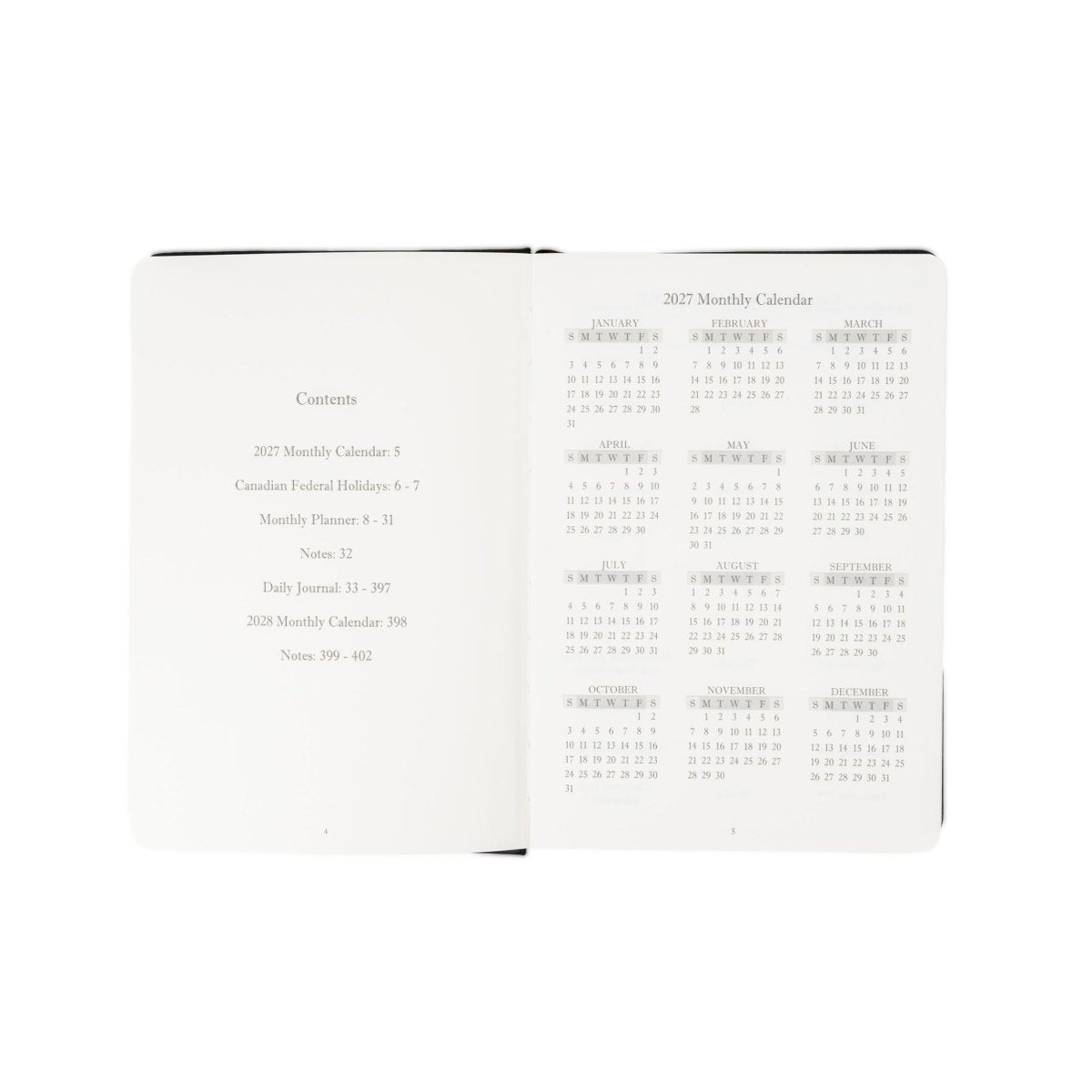 Executive journal open, showing contents list and 2027 monthly calendar layout.