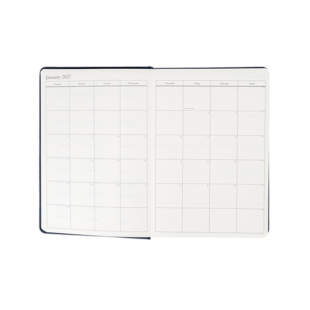2027 executive journal opened to monthly calendar grid pages