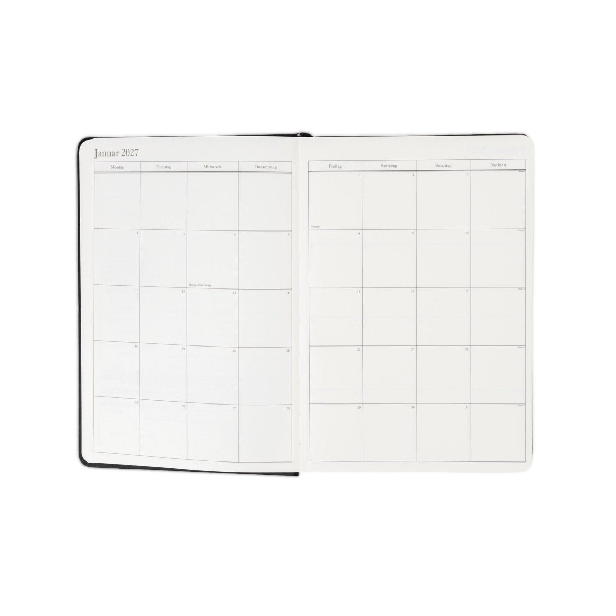 Executive journal planner open to weekly schedule pages, black cover, 2027 layout.