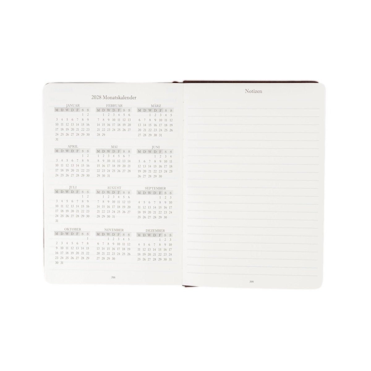 Open 2027 journal showing monthly calendar grid on left and lined notes on right