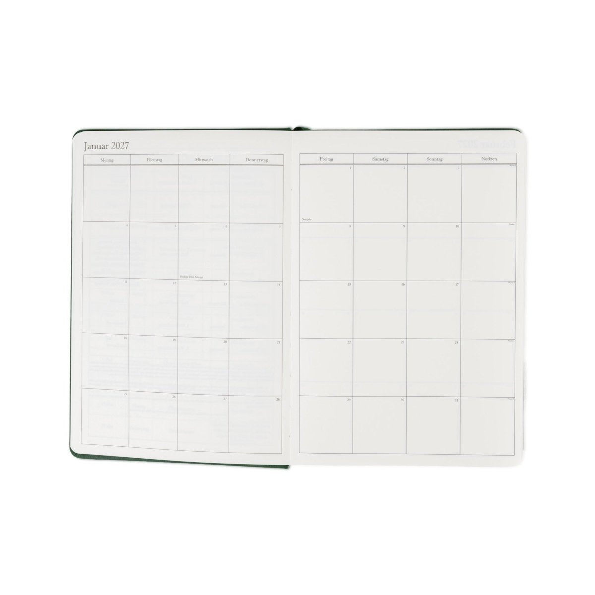 Executive journal planner open to weekly schedule pages, racing green cover, 2027 grid.