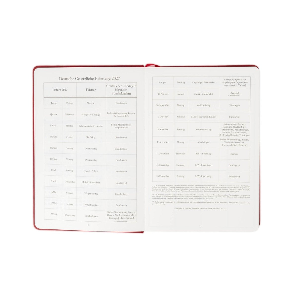 Open 2027 executive journal with red cover trim and German holiday calendar pages