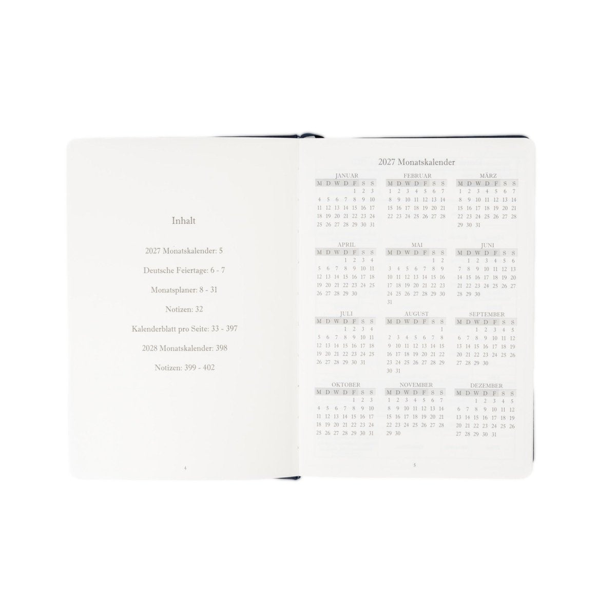 A5 executive journal open spread with contents list and 2027 calendar tables, pink edge binding