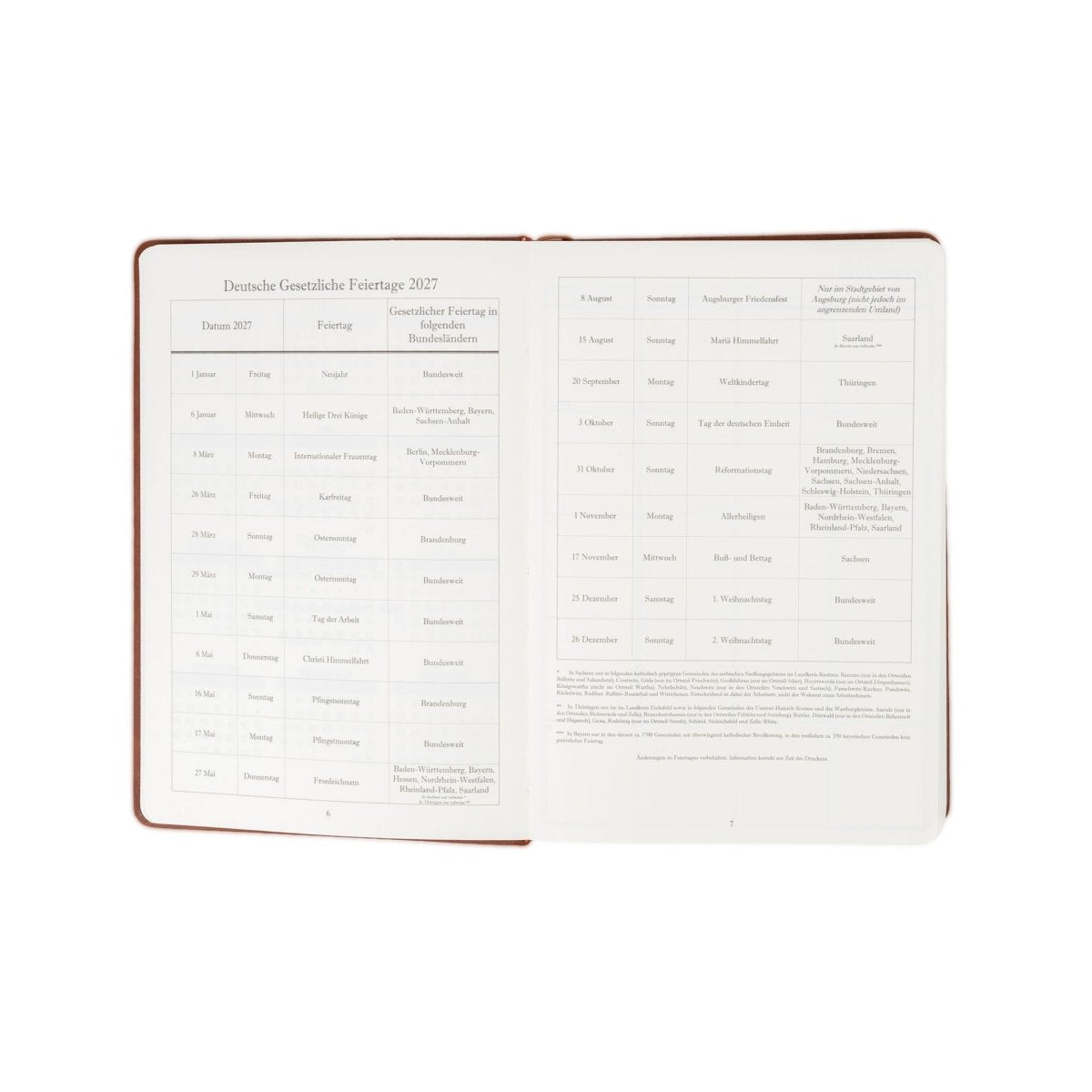 Open 2027 executive journal with brown cover trim and German holiday calendar pages