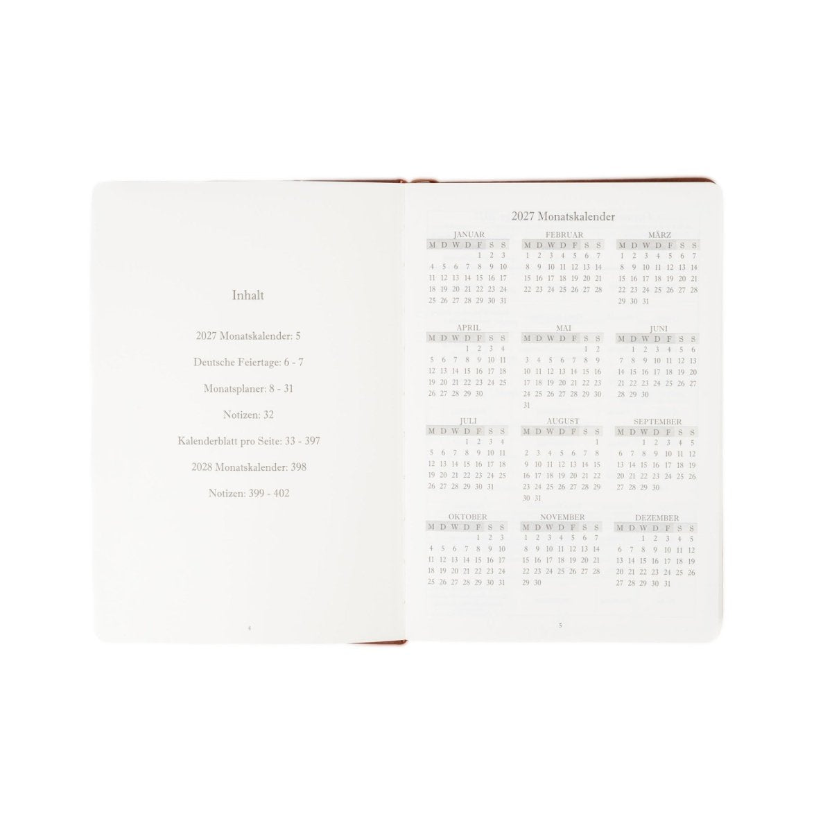 A5 executive journal open spread with contents list and 2027 calendar tables, brown edge binding