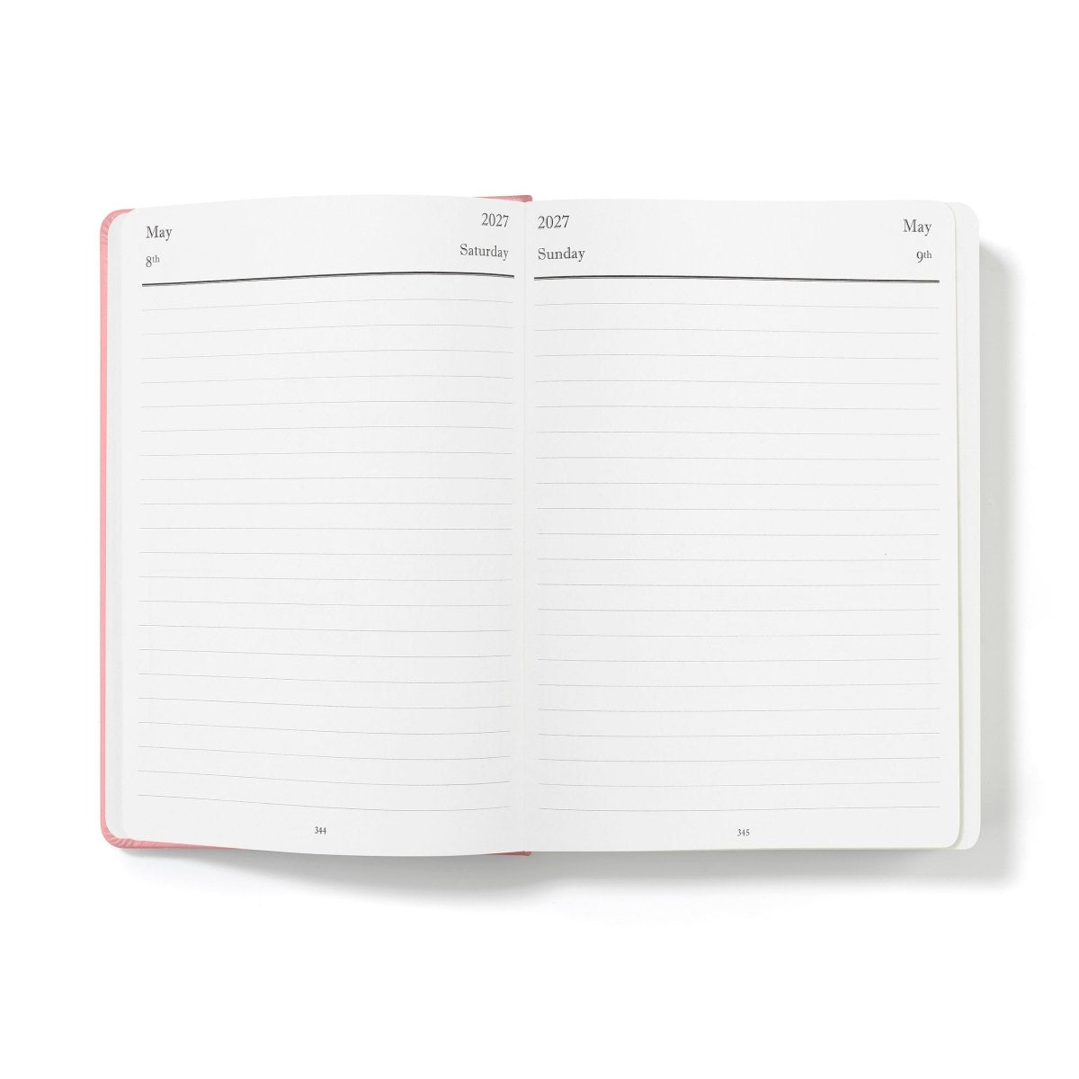Executive journal open to lined monthly planner pages with pink outer edge