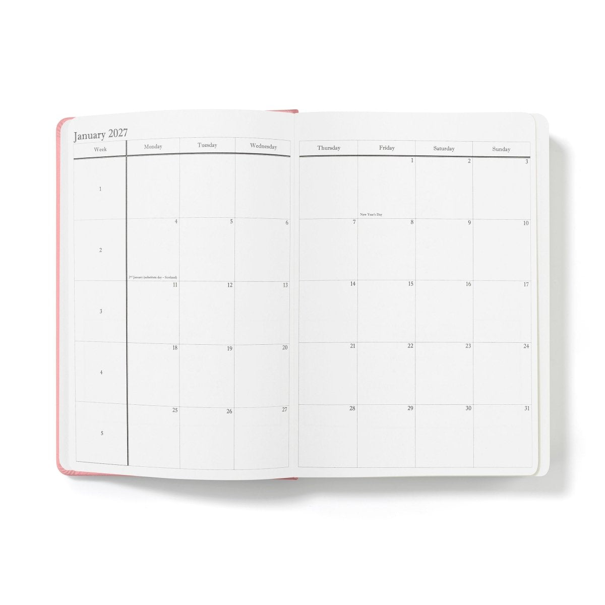 Executive journal open to calendar grid page with pink outer binding edge