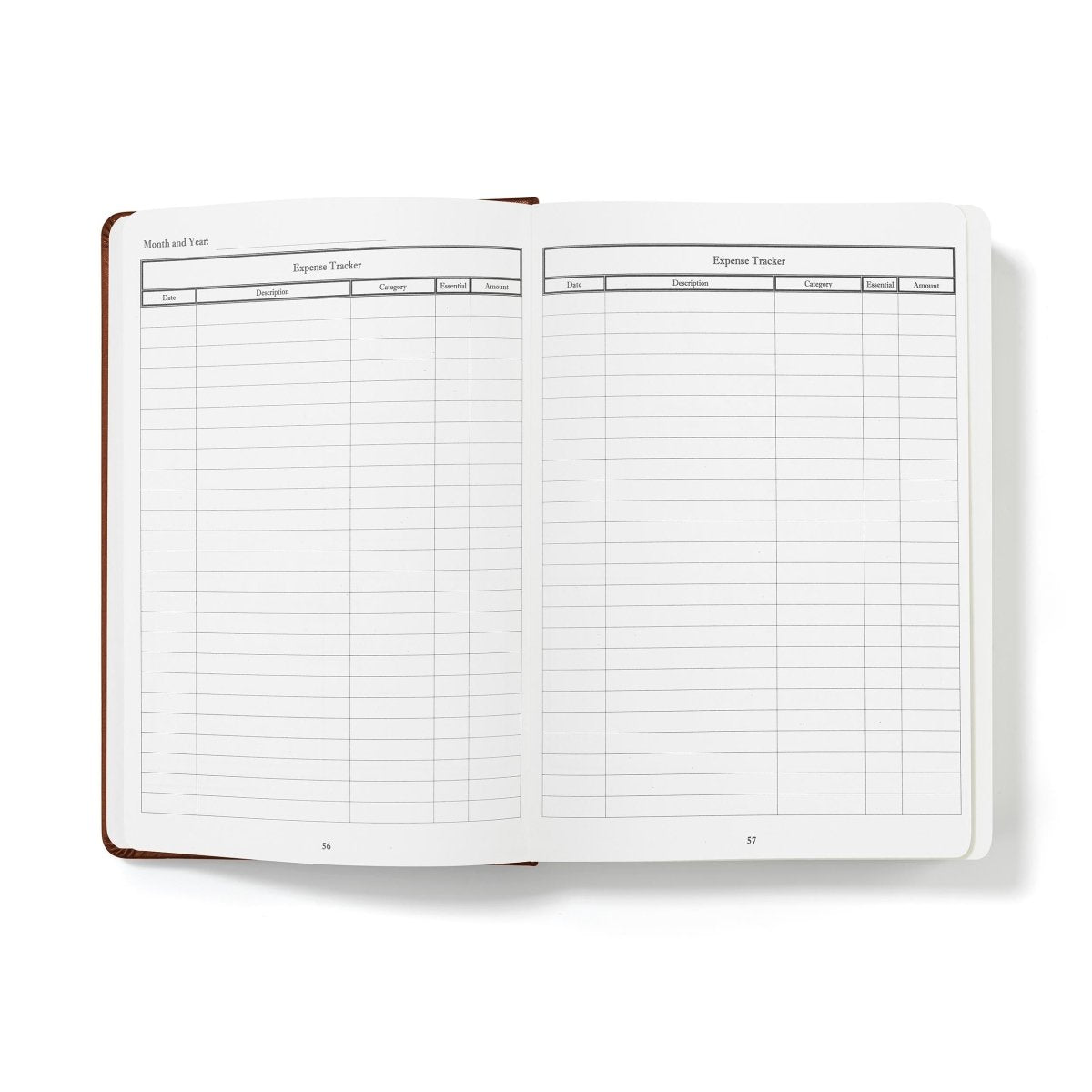Financial planner and monthly budgeting book, open to expense tracker grids with expense categories